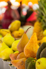 portion of pears stacked with an unfocused background