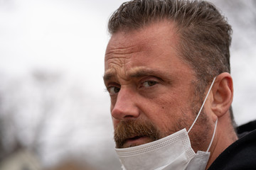 man wearing mask when he leaves his house
