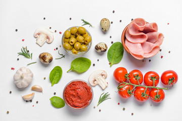Ingredients for tasty pizza on white background