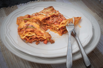 Lasagna slice on white plate