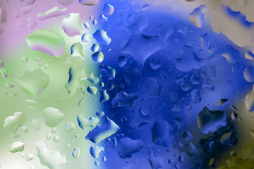 water drops on a multicolored background macro