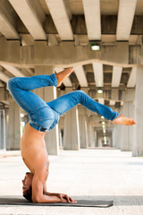 Mexican man practicing yoga in a urban background