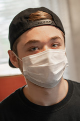 teen wearing a protective breathing mask