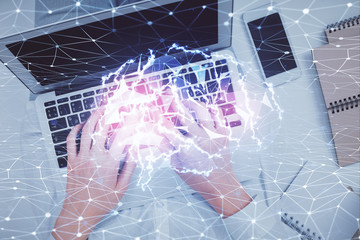 Double exposure of woman working on computer andhuman brain hologram drawing. Top View. Ai concept.