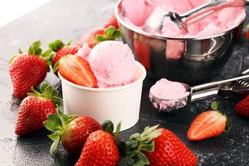 Strawberry ice cream scoop with fresh strawberries and waffle icecream cones