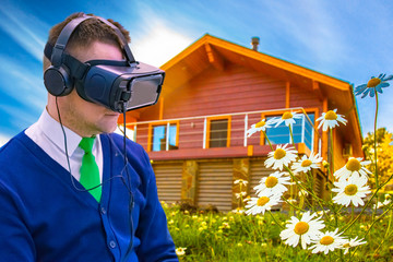 Using new technologies to visualize the image of a new home. A man in a virtual reality helmet. A person sees a future home. New method. Second reality.