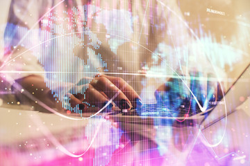 Double exposure of woman hands typing on computer and business theme hologram drawing. Success...