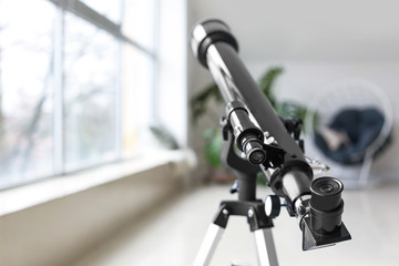 Modern telescope in room, closeup