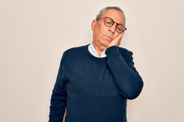 Senior handsome grey-haired man wearing sweater and glasses over isolated white background thinking looking tired and bored with depression problems with crossed arms.