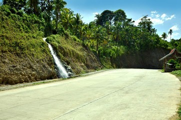Waterfall beside the road photo
