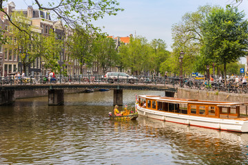Boat passing under bridge