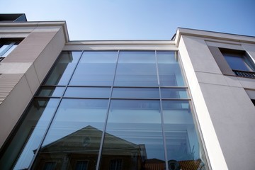  New and old architecture. View of city in sun day.