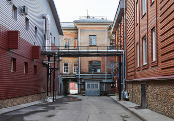 city alley with vintage and new buildings