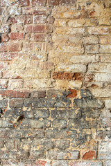 wall of very old dirty red bricks