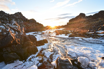 Stunning view of Öxarárfoss Waterfall at Thingvellir National Park during sunset. These waterfalls are situated between two tectonic plates in Iceland, Europe.