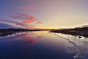 Fototapeta premium Lake in Thingvellir National Park, Iceland during sunset in wintertime. Rural, outdoor.