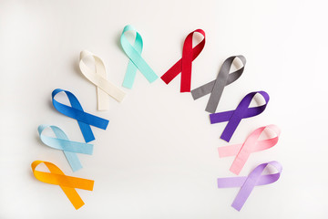 Colorful cancer ribbons as Health symbols for all types of cancer in a semi circle