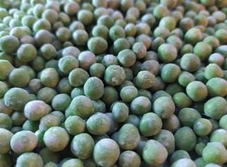 green frozen fresh peas background, texture