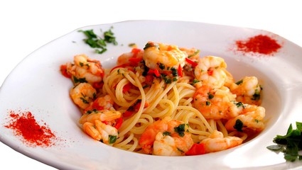 Studio photo of a mediterranean salad with spaghetti , shrimps and spices