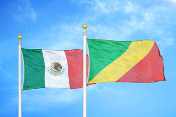 Mexico and Congo  two flags on flagpoles and blue cloudy sky