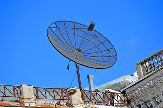 satellite antenna with converter on the building rooftop, modern telecommunication diversity