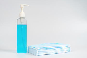 Medical surgical mask and sanitizer hand gel bottle for hand hygiene covid-19 virus protection isolated on white background. Concept of health care products.corona virus prevention.