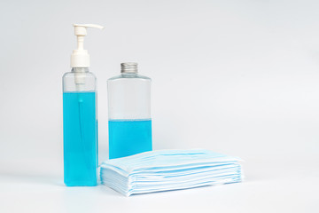 Medical surgical mask and sanitizer hand gel bottle for hand hygiene covid-19 virus protection isolated on white background. Concept of health care products.corona virus prevention.