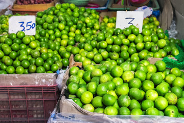 Street marketplace with lime in outdoor market, Bangkok, Thailand