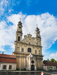 Fototapeta na wymiar Church of the Ascension, Roman Catholic Lithuanian Church in Vilnius, Lithuania. Panoramic summer view with blue cloudy sky