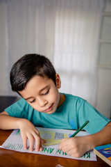 child drawing at home the slogan stay home