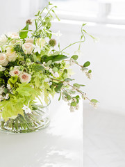 Flower bouquet near a window. 