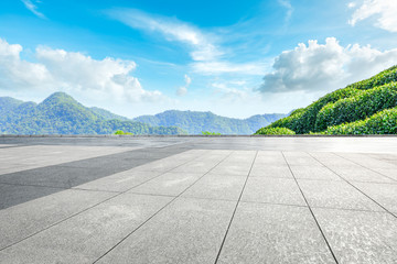 Empty square floor and green tea plantation nature landscape.