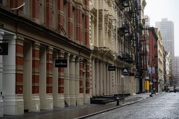 Empty New York City streets without people and closed shops during pandemic coronavirus outbreak in America. 