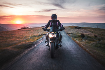 Motorcycle Ride Across Scenic Countryside at Sunrise