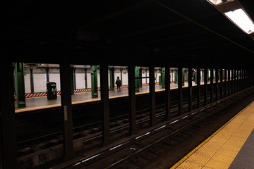 New York subway train station. Manhattan rail road. Subway cars with random people. Empty train stations in New York City. 