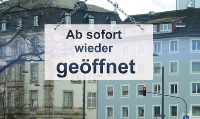 Information in a shop window with the text: Ab sofort wieder geöffnet (in ingles: From now on open...