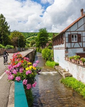 Village of Andleau Alsace, France. The river Andleau passing by home.