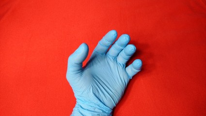 Open left hand with medical gloves