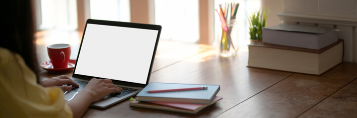 Cropped shot of young female college student doing homework