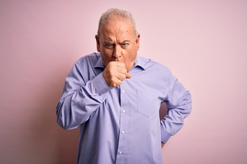 Obraz premium Middle age handsome hoary man wearing casual shirt standing over pink background feeling unwell and coughing as symptom for cold or bronchitis. Health care concept.