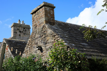 Fototapeta na wymiar Margaret's Hope - Orkney (Scotland), UK - August 10, 2018: Typical stone house in St Margaret's Hope village, Orkney, Scotland, Highlands, United Kingdom