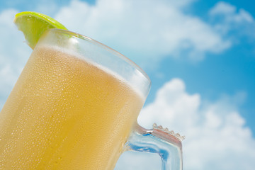 Beer jar in a sunny cloudy blue sky