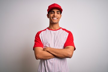 Young handsome african american sportsman wearing striped baseball t-shirt and cap happy face...