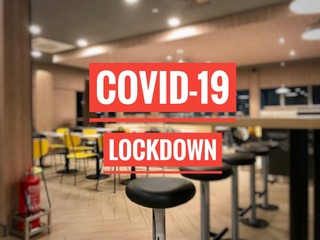 text covid-19, lockdown on blurred image background