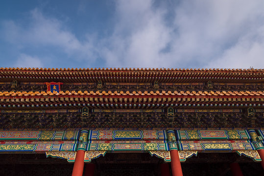 A Chinese tiled decorative palace roof located in the Forbidden City in Beijing, China. 