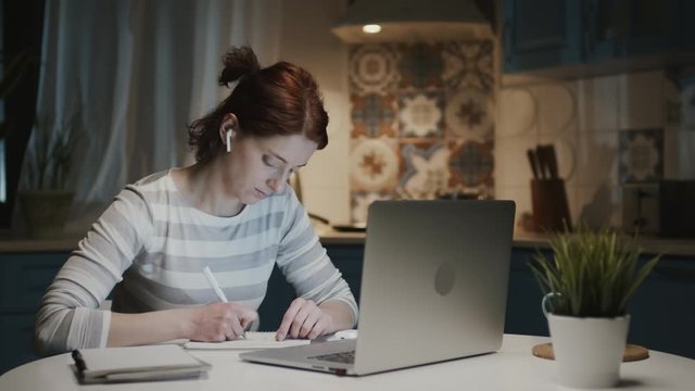 Woman In The Kitchen With Laptop.
