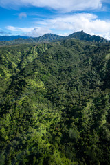 Fototapeta na wymiar Aerial View of Nature Landscape in Kauai, Hawaii during Warm Summer Weather with Mountains and Clouds