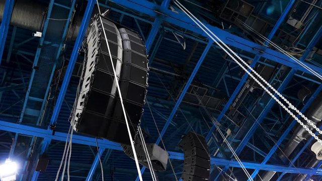 Installation of professional audio equipment. Stock footage. Powerful curved sound speakers for better sound at concerts or competitions