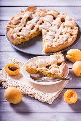 Naklejka na ściany i meble apricot pie on a wooden table