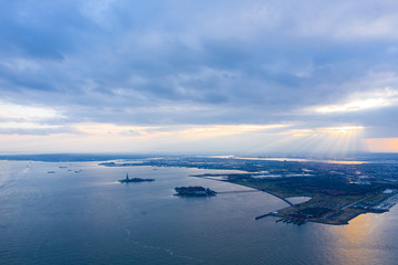 Naklejka na ściany i meble Aerial photograph of Jersey Ellis Island with the Hudson Rivers at Sunset, New York 